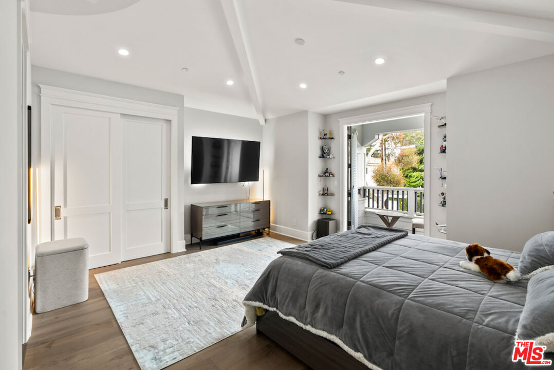 592 30th Street Manhattan Beach, CA 90266 - Photo 48 of 57 a bedroom with a bed and a flat screen tv