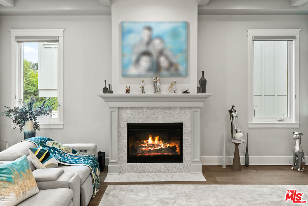 592 30th Street Manhattan Beach, CA 90266 - Photo 8 of 57 a living room with furniture and a fireplace