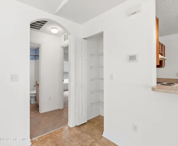 a view of a bathroom with a shower and a sink
