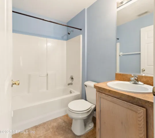 a bathroom with a sink a toilet and a bathtub