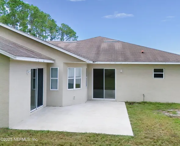 an aerial view of residential house with outdoor space