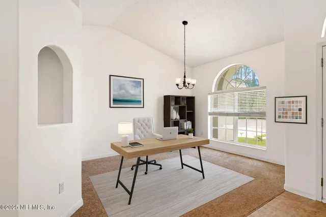 a workspace with furniture window and wooden floor