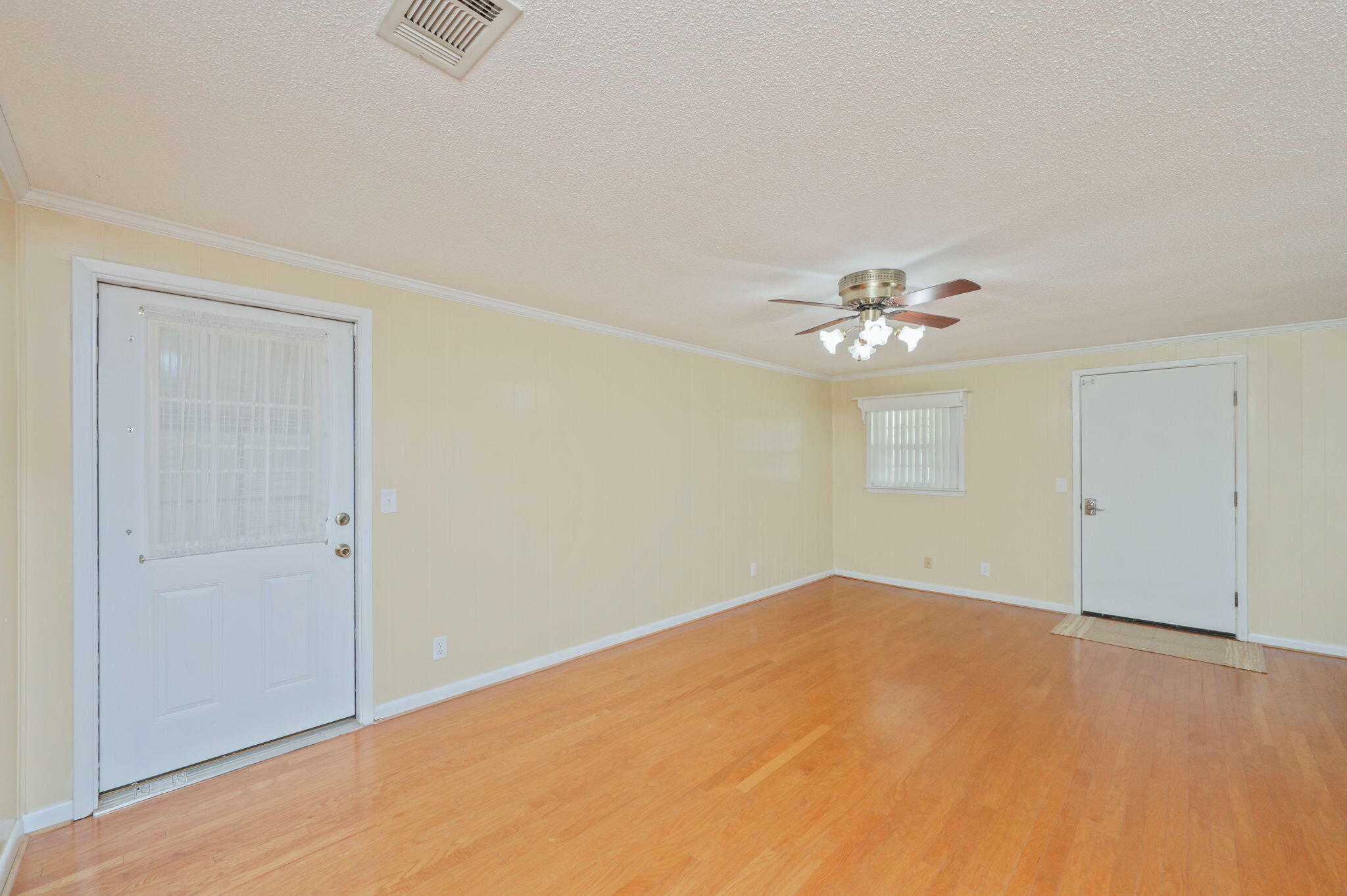 501 Jones Road Crestview, FL 32536 - Photo 9 of 32 a view of an empty room with chandelier fan