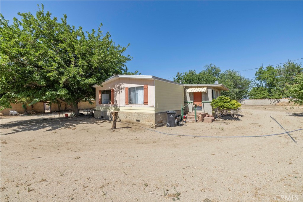 15374 Gaskell Road Rosamond, CA 93560 - Photo 18 of 74 a view of a house with a patio