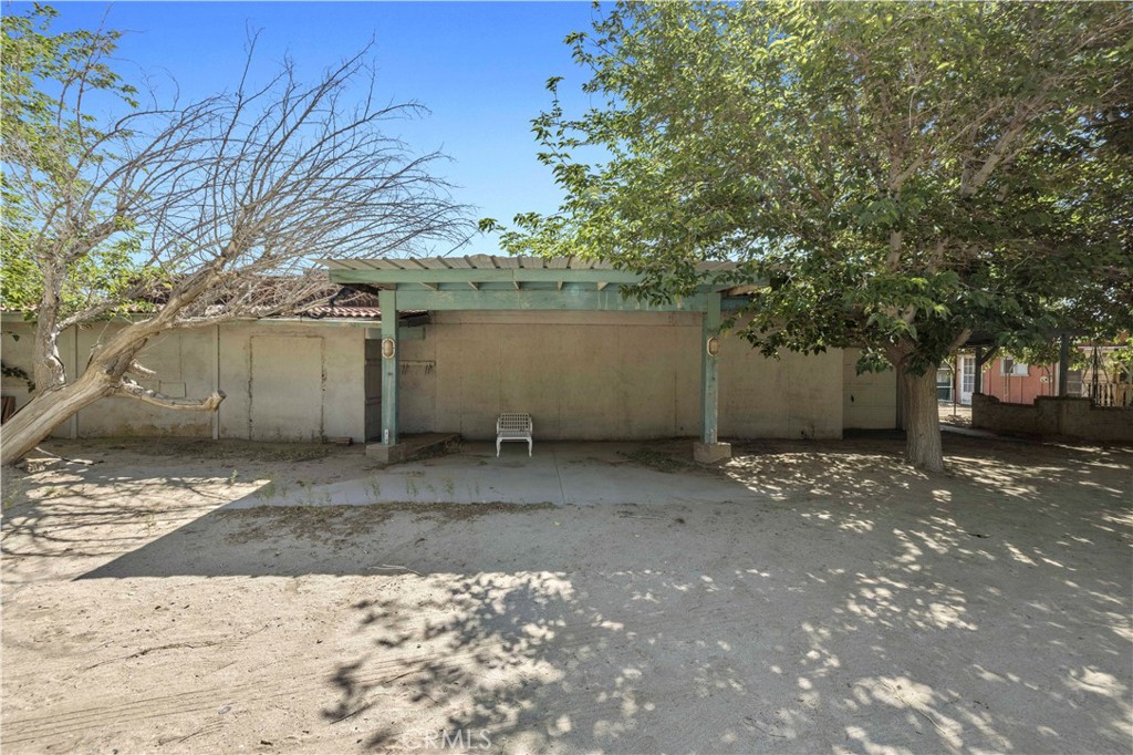 15374 Gaskell Road Rosamond, CA 93560 - Photo 21 of 74 a view of a street with a tree