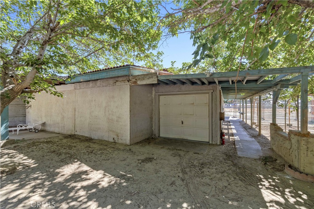 15374 Gaskell Road Rosamond, CA 93560 - Photo 22 of 74 a view of a house with a outdoor space