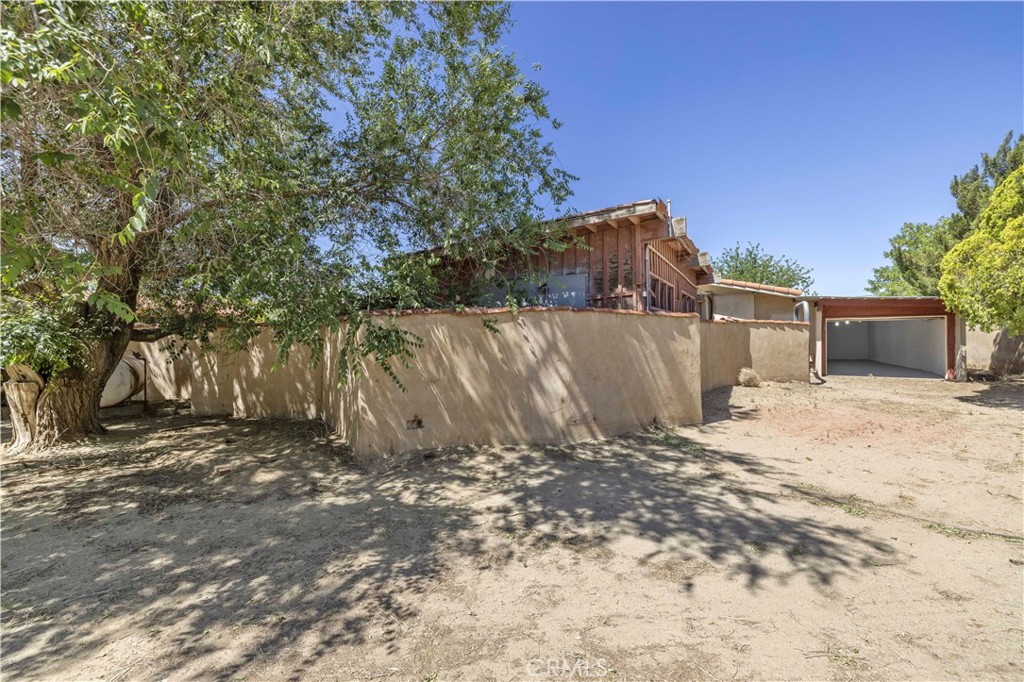 15374 Gaskell Road Rosamond, CA 93560 - Photo 24 of 74 a view of a house with a yard