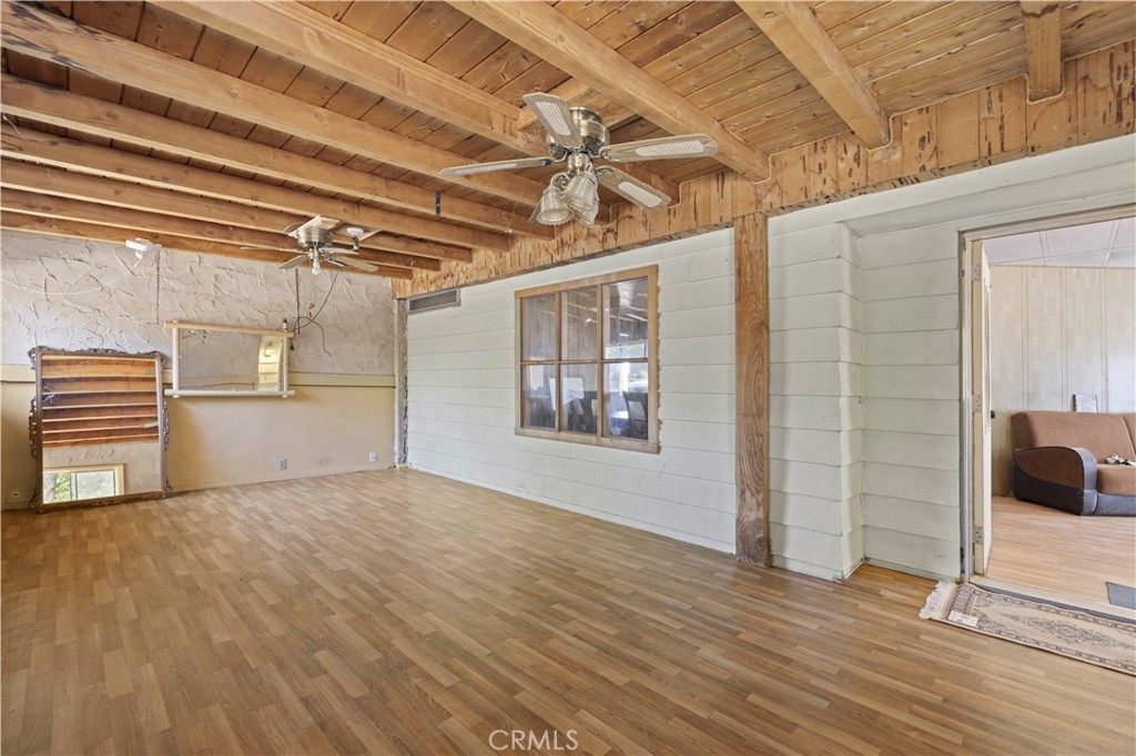 15374 Gaskell Road Rosamond, CA 93560 - Photo 28 of 74 a view of empty room with wooden floor
