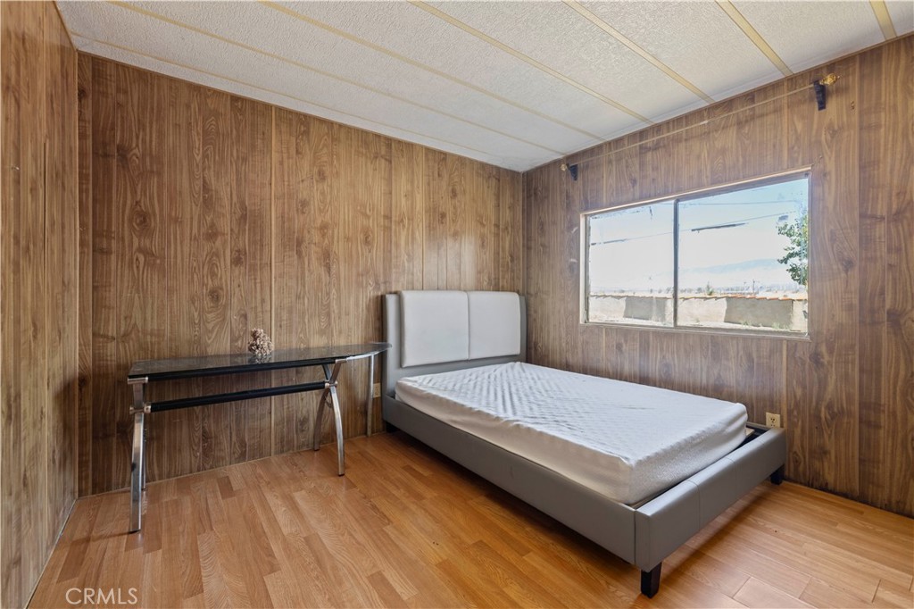 15374 Gaskell Road Rosamond, CA 93560 - Photo 39 of 74 a bedroom with a bed and window