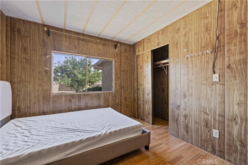15374 Gaskell Road Rosamond, CA 93560 - Photo 40 of 74 a bedroom with a bed and a window