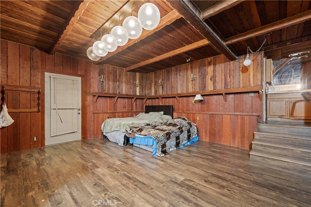 15374 Gaskell Road Rosamond, CA 93560 - Photo 47 of 74 a bedroom with a bed and a mirror