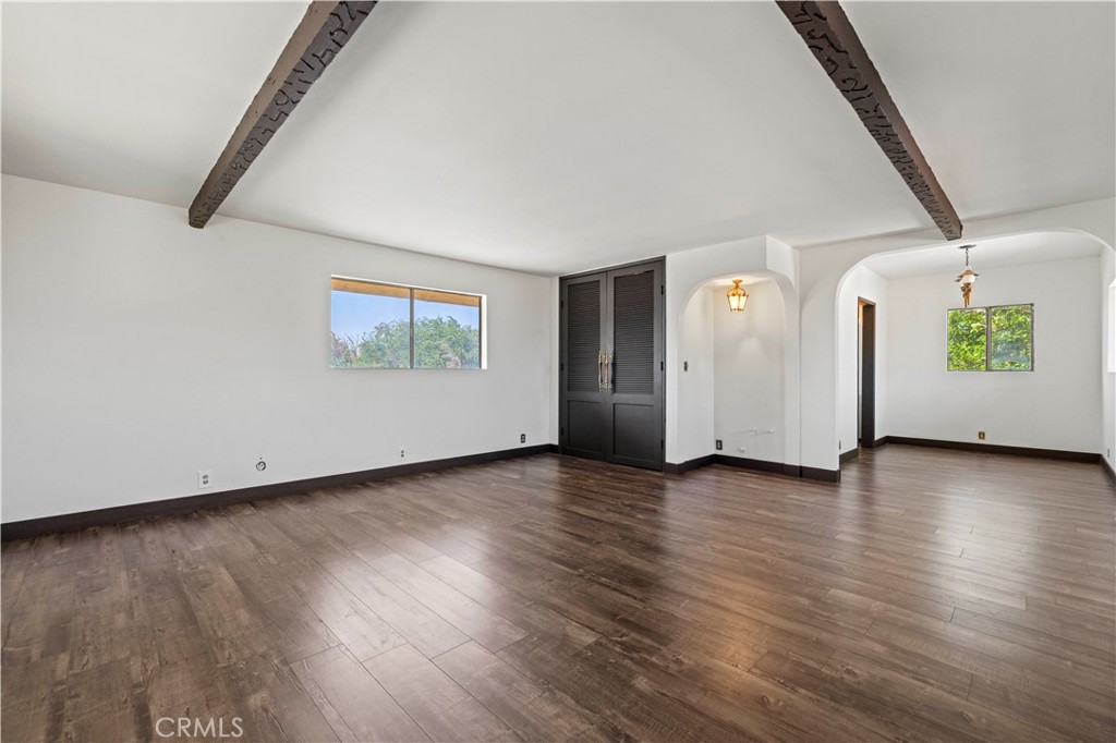 15374 Gaskell Road Rosamond, CA 93560 - Photo 50 of 74 wooden floor in an empty room with a window