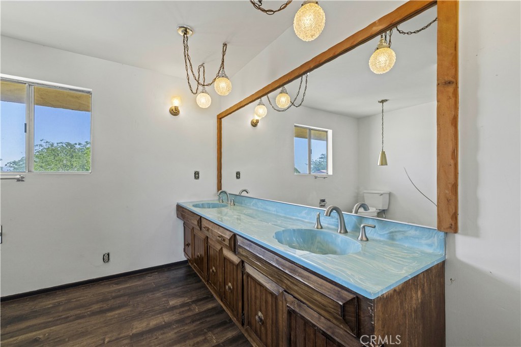 15374 Gaskell Road Rosamond, CA 93560 - Photo 54 of 74 a bathroom with a sink and a mirror