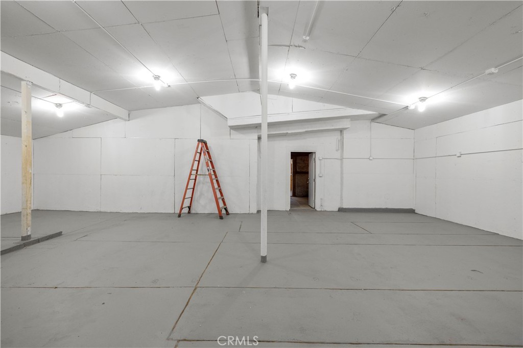 15374 Gaskell Road Rosamond, CA 93560 - Photo 63 of 74 a view of a room with a ceiling fan and entryway