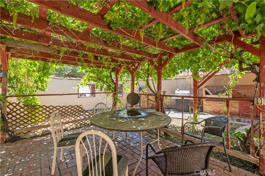 15374 Gaskell Road Rosamond, CA 93560 - Photo 65 of 74 a table and chairs in a patio