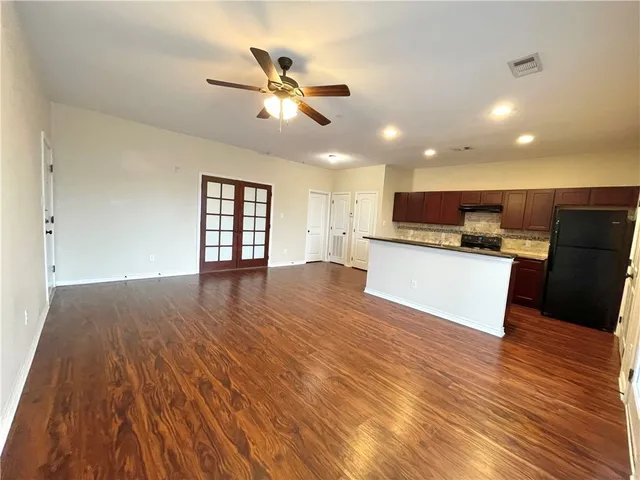 a view of a house with a yard and stairs