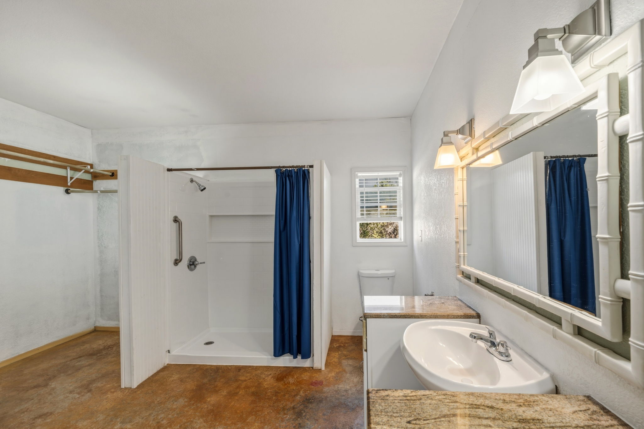 1301 Altwein Road Blanco, TX 78606 - Photo 24 of 40 Bathroom featuring concrete flooring, vanity, and a stall shower