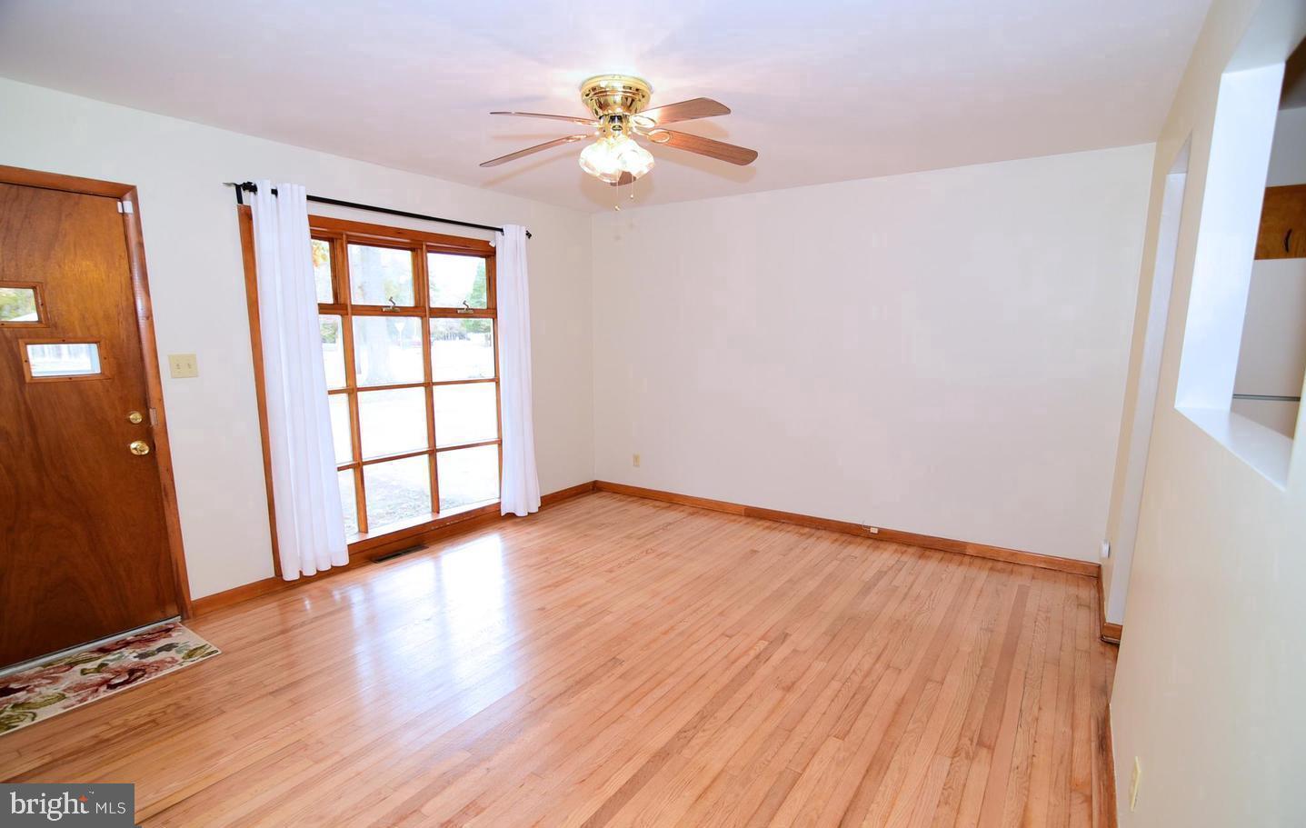 5210 Colebrook Drive La Plata, MD 20646 - Photo 16 of 27 wooden floor in an empty room with a window