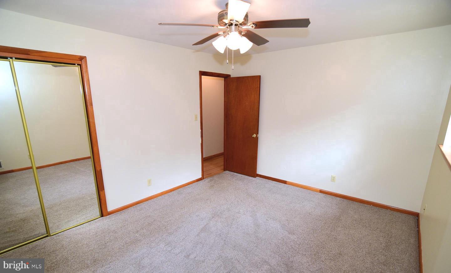 5210 Colebrook Drive La Plata, MD 20646 - Photo 2 of 27 an empty room with closet and a chandelier fan