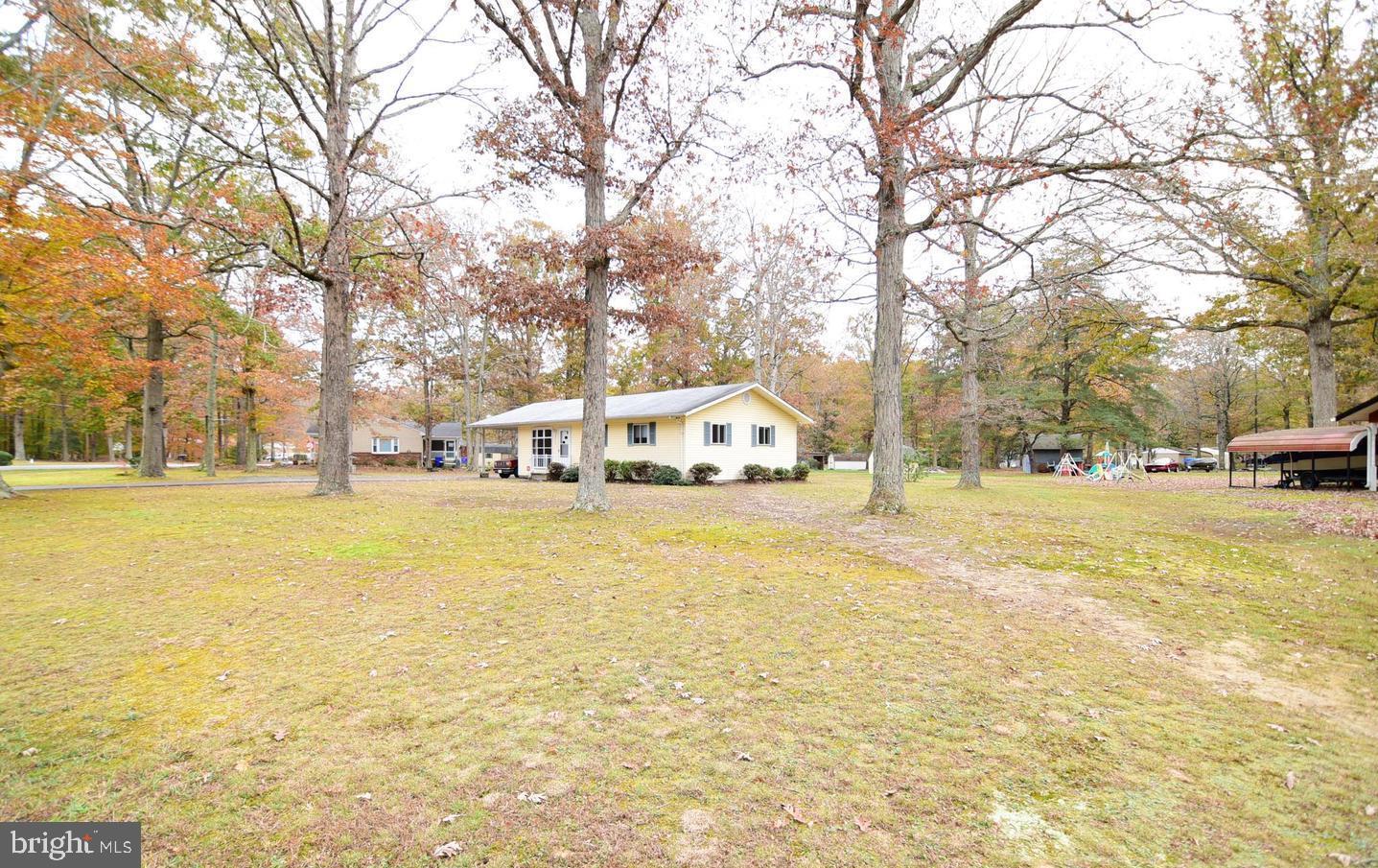 5210 Colebrook Drive La Plata, MD 20646 - Photo 23 of 27 a white house that has a tree in front of it