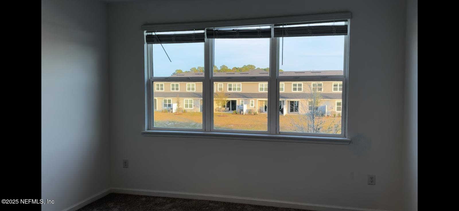 213 Silver Myrtle Court St. Augustine, FL 32092 - Photo 11 of 25 a view of empty room with a window