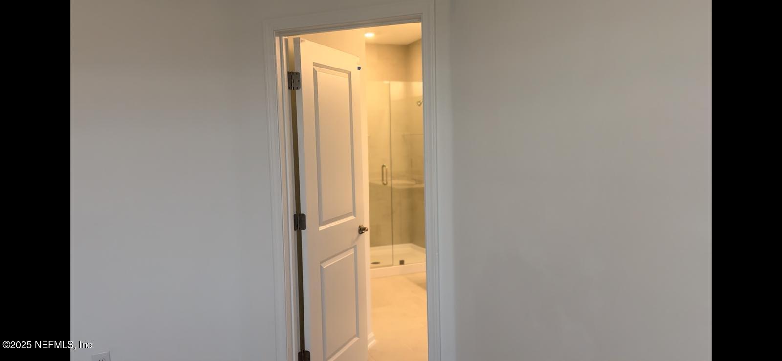 213 Silver Myrtle Court St. Augustine, FL 32092 - Photo 14 of 25 a bathroom with a tub and shower