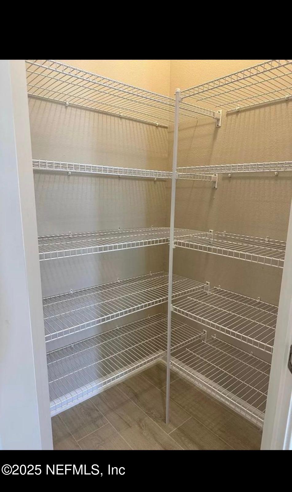 213 Silver Myrtle Court St. Augustine, FL 32092 - Photo 6 of 25 a view of a room with wooden floor