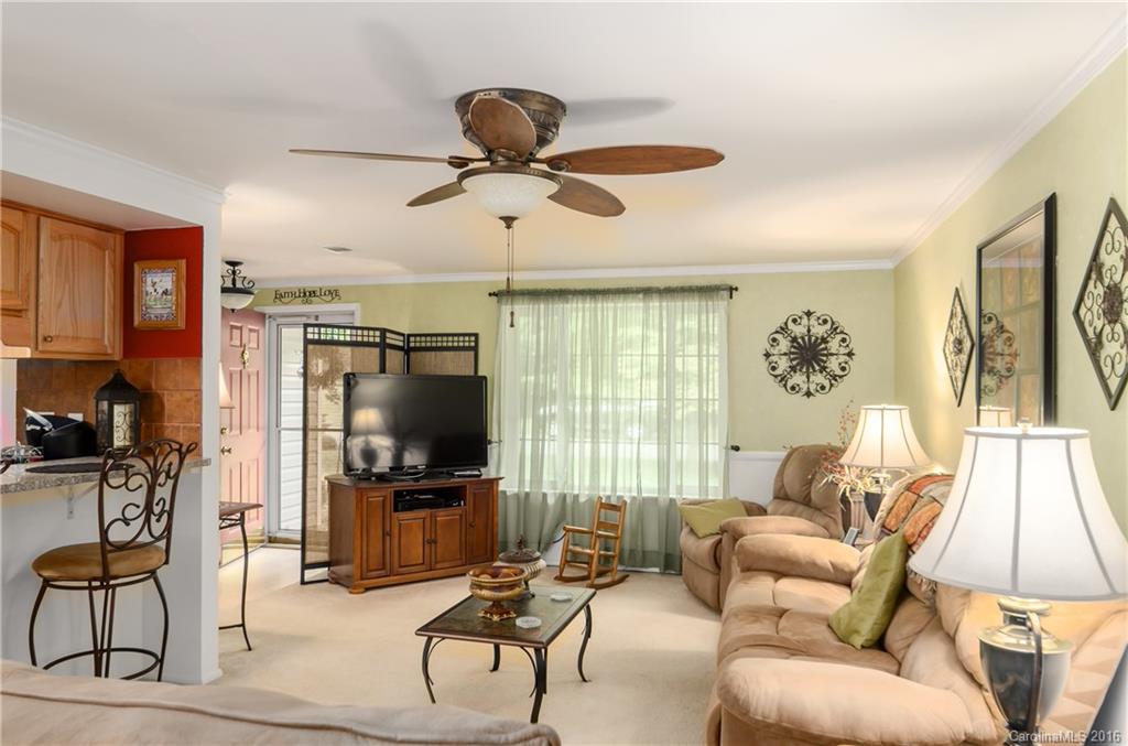 4823 Smokehollow Road Charlotte, NC 28227 - Photo 13 of 19 a living room with furniture and a flat screen tv