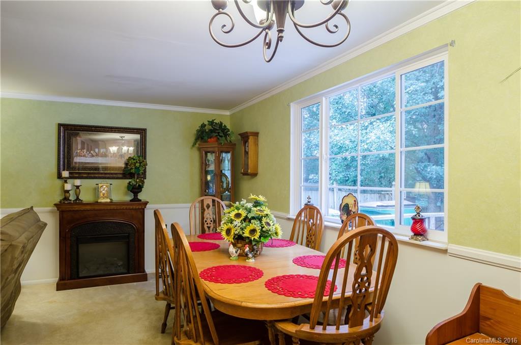 4823 Smokehollow Road Charlotte, NC 28227 - Photo 16 of 19 a dining room with furniture and window