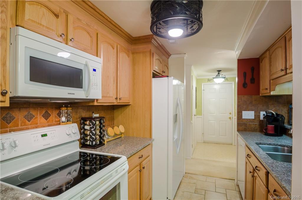 4823 Smokehollow Road Charlotte, NC 28227 - Photo 3 of 19 a kitchen with stainless steel appliances granite countertop a stove and a microwave