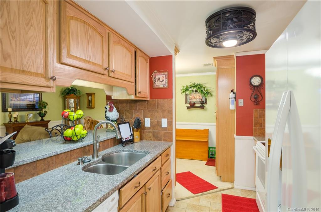 4823 Smokehollow Road Charlotte, NC 28227 - Photo 4 of 19 a kitchen with stainless steel appliances granite countertop a sink and a granite counter tops