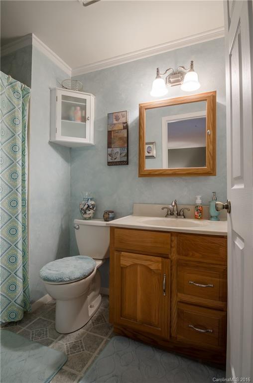4823 Smokehollow Road Charlotte, NC 28227 - Photo 6 of 19 a bathroom with a toilet sink and mirror