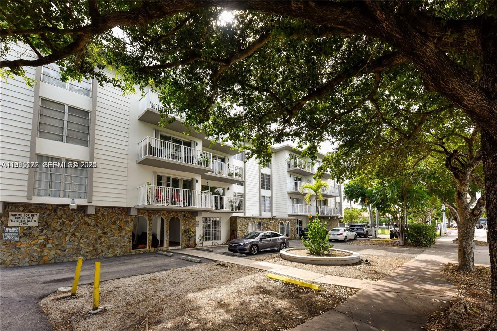 1220 71st Street, Unit 38 Miami Beach, FL 33141 - Photo 1 of 22 a view of a street with houses