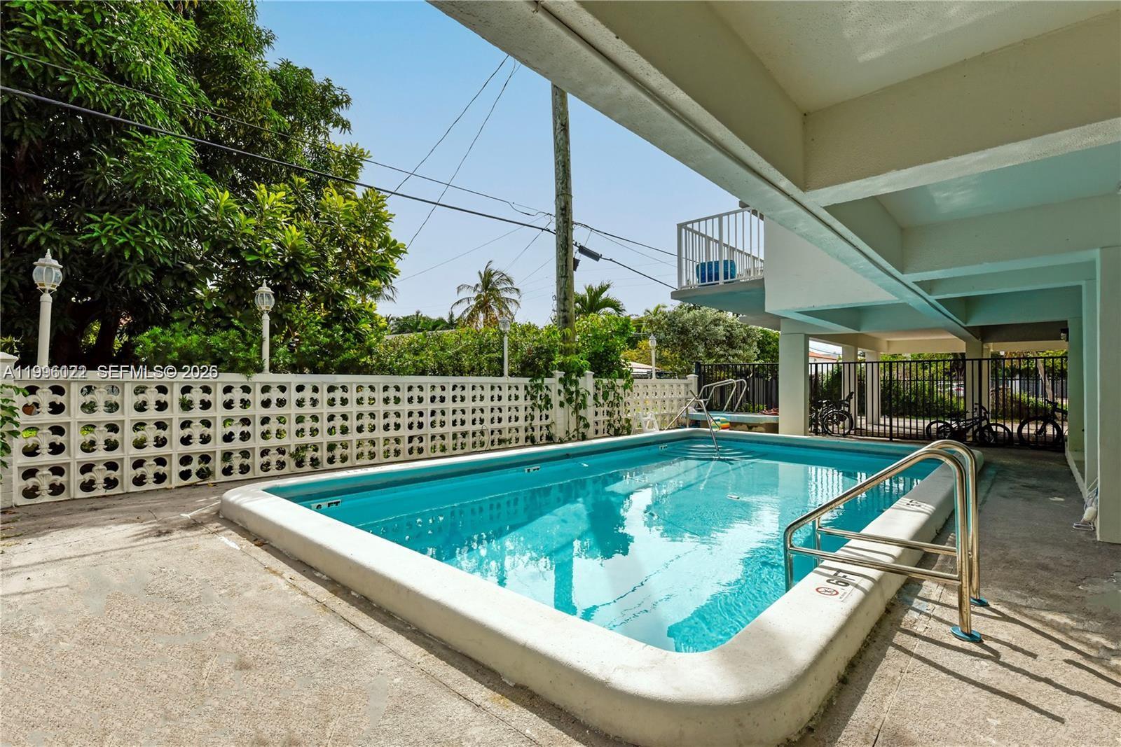1220 71st Street, Unit 38 Miami Beach, FL 33141 - Photo 20 of 22 a view of swimming pool having outdoor seating
