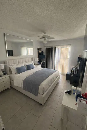 a bedroom with a bed and furniture