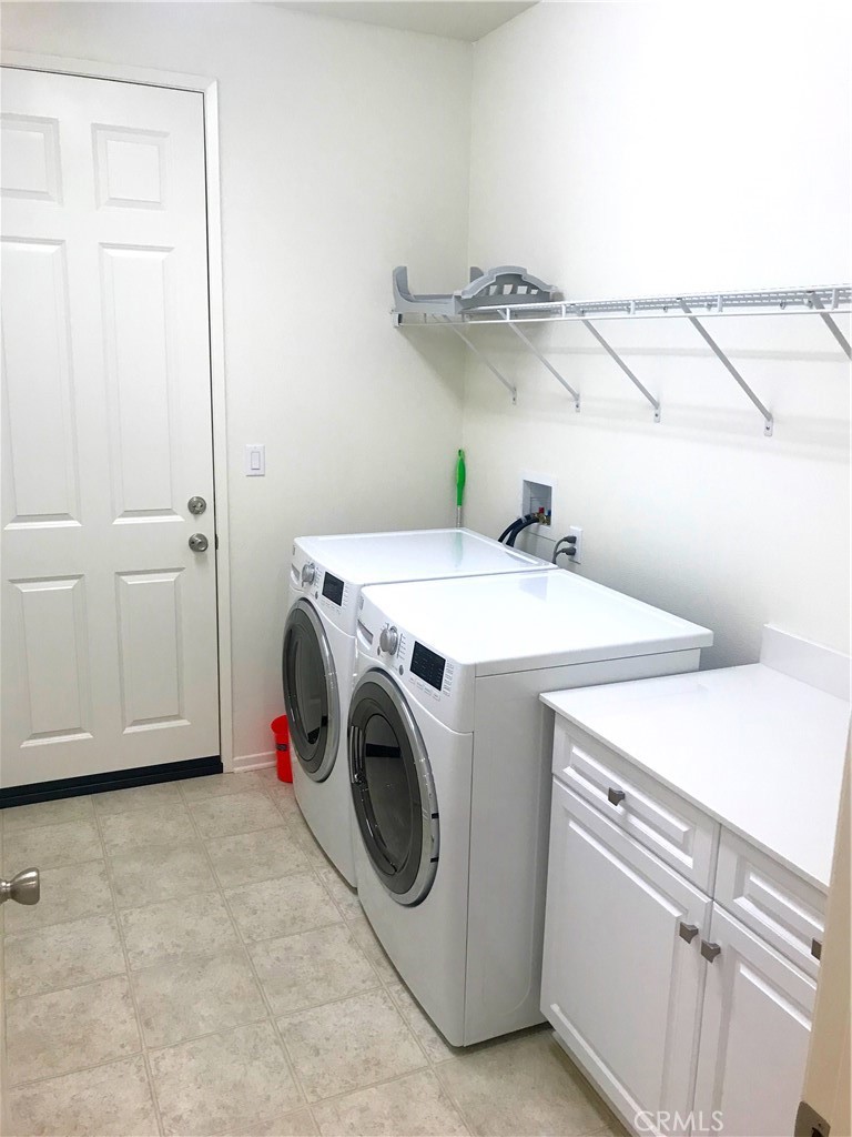 16031 Cordova Road Victorville, CA 92394 - Photo 16 of 34 a utility room with dryer and washer