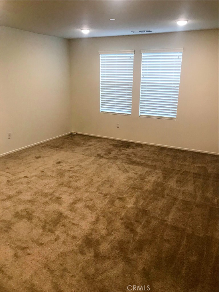 16031 Cordova Road Victorville, CA 92394 - Photo 19 of 34 an empty room with a window