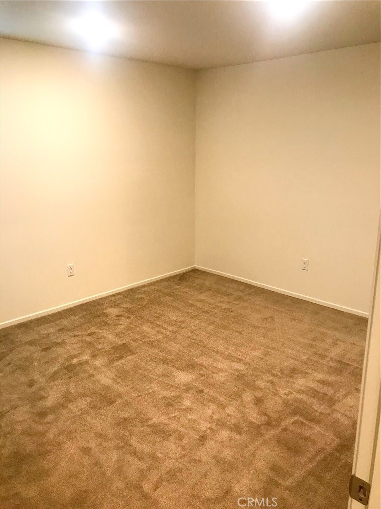 16031 Cordova Road Victorville, CA 92394 - Photo 20 of 34 an empty room with an entryway