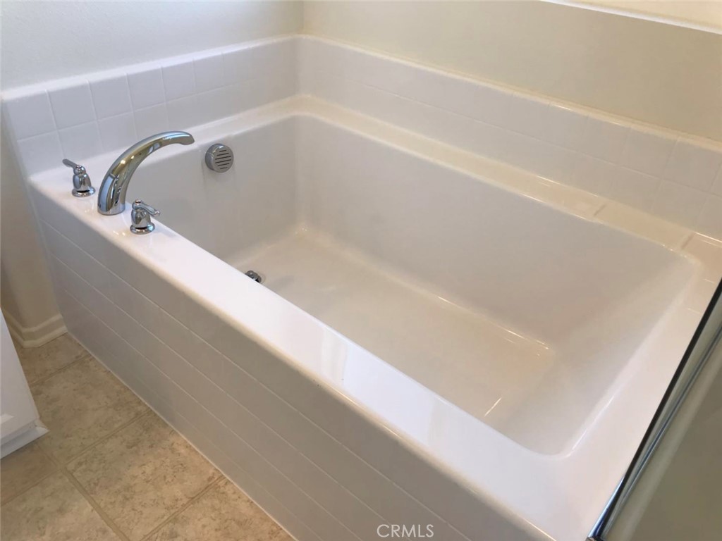 16031 Cordova Road Victorville, CA 92394 - Photo 22 of 34 a close view of a bathtub in a bathroom