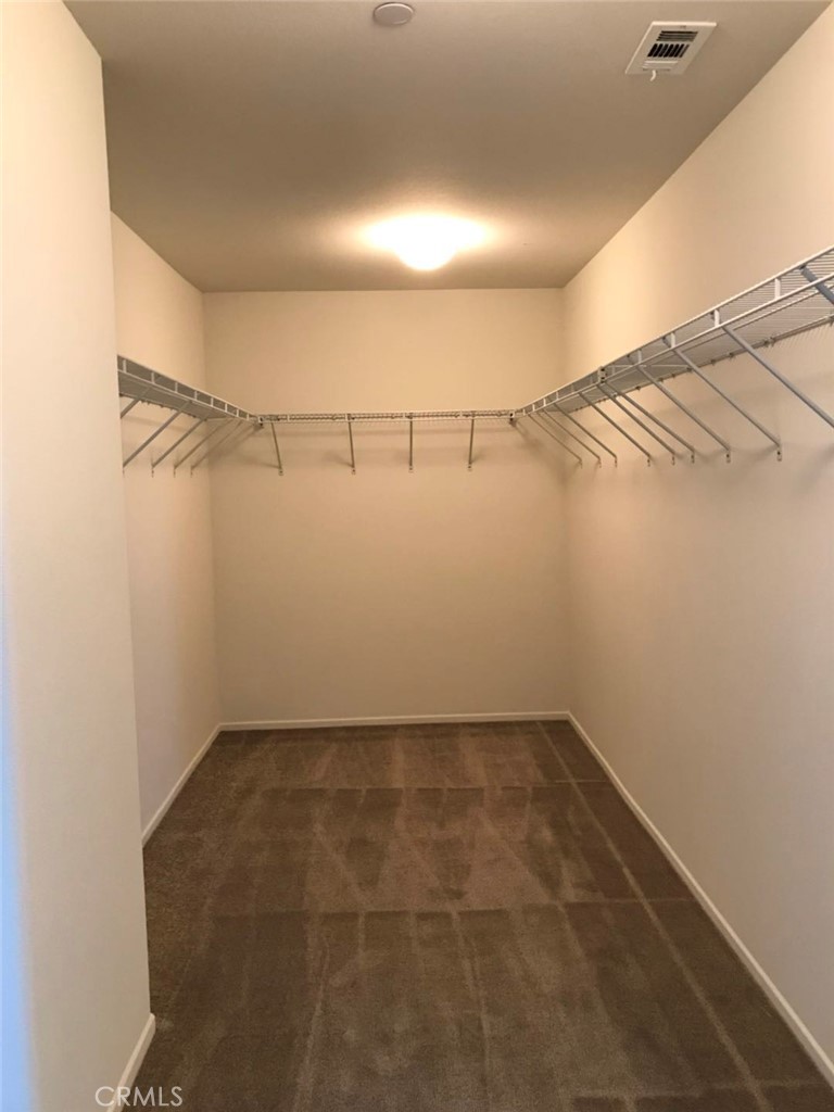 16031 Cordova Road Victorville, CA 92394 - Photo 23 of 34 a view of a room with racks on the wall