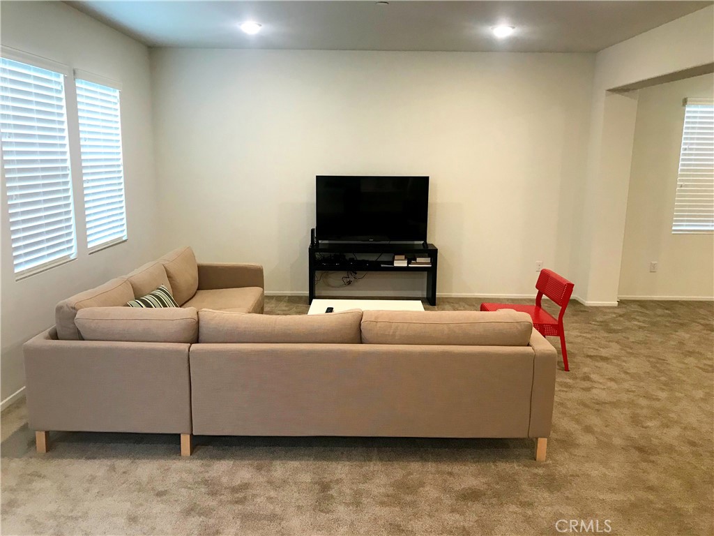 16031 Cordova Road Victorville, CA 92394 - Photo 6 of 34 a living room with furniture and a flat screen tv