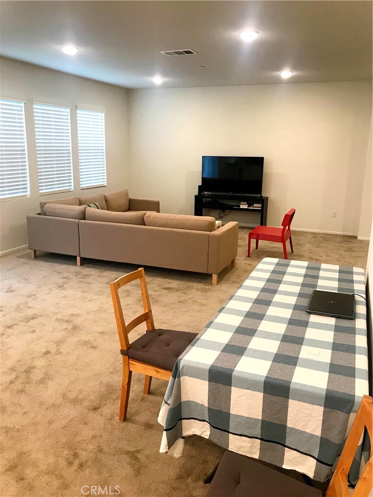 16031 Cordova Road Victorville, CA 92394 - Photo 10 of 34 a living room with furniture and a flat screen tv