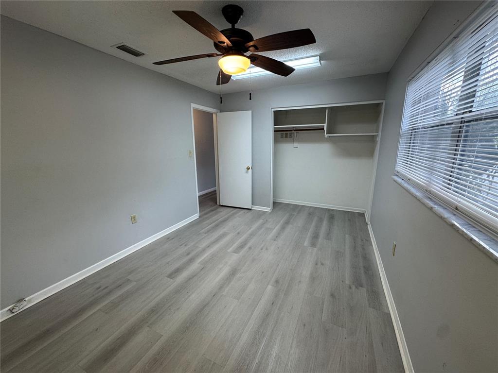 1610 High Street Leesburg, FL 34748 - Photo 7 of 11 wooden floor in an empty room