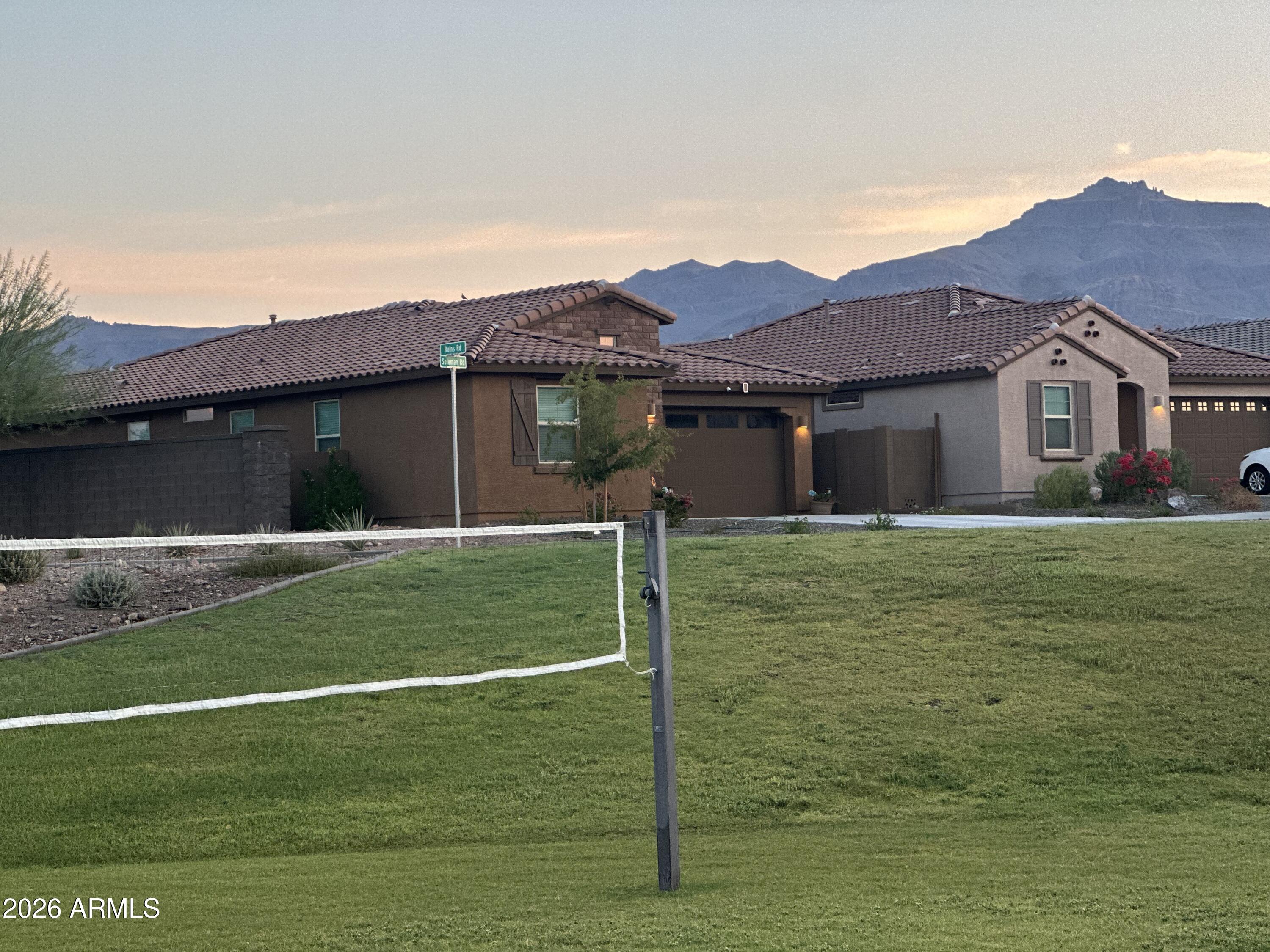 12330 East Soloman Road Gold Canyon, AZ 85118 - Photo 68 of 69 a front view of a house with a garden