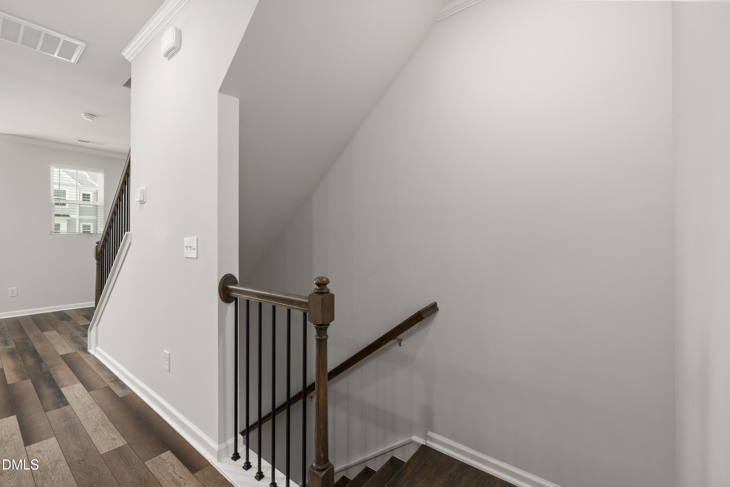 2524 Laurel Valley Way Raleigh, NC 27604 - Photo 11 of 12 a view of a hallway with wooden floor and staircase