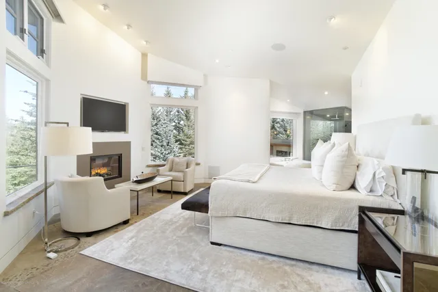 a bathroom with a bathtub shower and sink