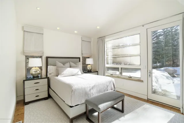 a spacious bathroom with a shower sink and mirror