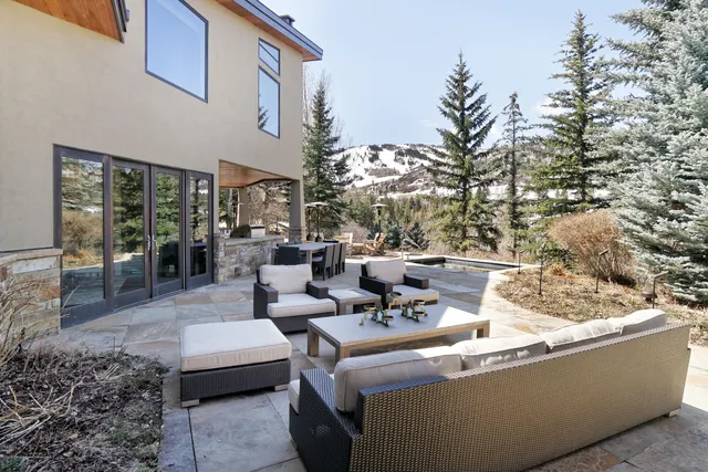 a view of a house with a outdoor sitting area