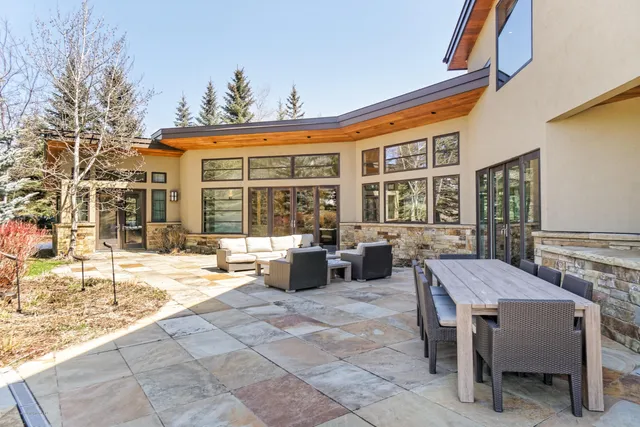 a front view of a house with basket ball court and a garage