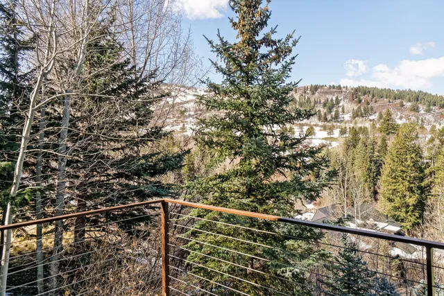 a outdoor living space with furniture and city view